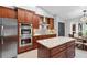 Well-equipped kitchen with stainless steel appliances, granite countertops, and ample cabinet space at 202 Yorkville Pl, Debary, FL 32713