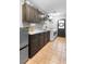 Functional laundry room with appliances, storage cabinets, and a utility sink at 202 Yorkville Pl, Debary, FL 32713