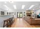 Spacious living room with skylights, fireplace, and access to the backyard at 202 Yorkville Pl, Debary, FL 32713