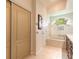 Bathroom features a tub, granite counters, dual closets and tile flooring at 212 Mallard Ln, Daytona Beach, FL 32119