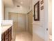 Bathroom showing granite counters, tile flooring, vanity and closet with sliding doors at 212 Mallard Ln, Daytona Beach, FL 32119
