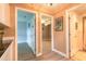 Bright hallway showcasing access to bedrooms and a bathroom with modern flooring at 212 Mallard Ln, Daytona Beach, FL 32119