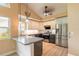 Modern kitchen featuring stainless steel appliances, granite countertops, and light-colored cabinetry at 212 Mallard Ln, Daytona Beach, FL 32119