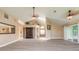 Expansive living room with modern flooring, vaulted ceilings, and decorative accents at 212 Mallard Ln, Daytona Beach, FL 32119