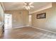 Bright living room boasts wood floors, vaulted ceiling, and natural light at 212 Mallard Ln, Daytona Beach, FL 32119