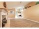 Spacious living room with fireplace, modern flooring, and views into the kitchen at 212 Mallard Ln, Daytona Beach, FL 32119