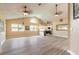 Open concept living area featuring modern flooring, vaulted ceilings, and lots of natural light at 212 Mallard Ln, Daytona Beach, FL 32119