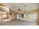 Bright living room featuring wood flooring, stylish lighting, and sliding glass doors leading to the outdoors at 212 Mallard Ln, Daytona Beach, FL 32119