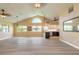 Bright and airy living room with high ceilings, modern floors, and an open layout to the kitchen at 212 Mallard Ln, Daytona Beach, FL 32119