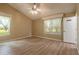 Light-filled living room with wood floors, vaulted ceiling, and sheer curtains at 212 Mallard Ln, Daytona Beach, FL 32119