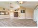 Spacious living area with modern floors, decorative ceiling fans, and access to the outdoor patio at 212 Mallard Ln, Daytona Beach, FL 32119