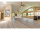 Spacious living room featuring vaulted ceilings, modern flooring, and abundant natural light at 212 Mallard Ln, Daytona Beach, FL 32119
