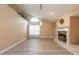 Spacious living room features high ceilings, a fireplace, and a large window at 212 Mallard Ln, Daytona Beach, FL 32119