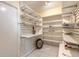 Spacious walk-in pantry with shelving, providing ample storage for all your kitchen essentials at 212 Mallard Ln, Daytona Beach, FL 32119