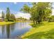 A serene view of the pond from the backyard of this lovely house at 212 Mallard Ln, Daytona Beach, FL 32119