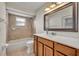 This bright bathroom has a soaking tub and shower, vanity with sink, and updated fixtures at 2237 Clearwater Dr, Deltona, FL 32738