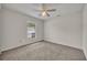 Neutral bedroom with standard-sized window, ceiling fan, plush carpet, and neutral walls at 2237 Clearwater Dr, Deltona, FL 32738
