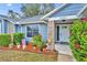Inviting front porch adorned with colorful flowers and charming decorations, creating a warm and welcoming entrance at 2237 Clearwater Dr, Deltona, FL 32738