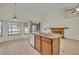 Kitchen island with stainless steel sink and view of the breakfast nook at 2237 Clearwater Dr, Deltona, FL 32738