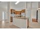 Kitchen with island, stainless appliances, and view of the front door at 2237 Clearwater Dr, Deltona, FL 32738