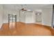 Open-concept living area with wood-look tile, featuring high ceilings and access to the backyard, ideal for gatherings at 2237 Clearwater Dr, Deltona, FL 32738