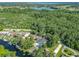 An aerial view of an exclusive neighborhood, including private waterway access and the chain of lakes at 28432 Tammi Dr, Tavares, FL 32778