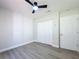 Spacious bedroom featuring new ceiling fan and vinyl flooring at 28432 Tammi Dr, Tavares, FL 32778