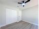 Bedroom showcasing double closet and new ceiling fan at 28432 Tammi Dr, Tavares, FL 32778