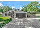 Well-maintained, one-story home featuring a two-car garage and covered parking with mature trees in a quiet neighborhood at 28432 Tammi Dr, Tavares, FL 32778
