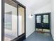 Bright foyer with sleek doors, modern light fixtures, and stylish painted floors at 28432 Tammi Dr, Tavares, FL 32778