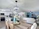 Open-concept living space with kitchen island overlooking dining area and living room, perfect for entertaining at 28432 Tammi Dr, Tavares, FL 32778