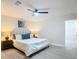 Comfortable main bedroom with bedside lamps and ceiling fan at 28432 Tammi Dr, Tavares, FL 32778