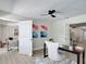 Light-filled home office with neutral color palette, contemporary desk, and open doorway at 28432 Tammi Dr, Tavares, FL 32778