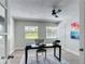 Cozy home office with natural light, modern furnishings, and view to the outside at 28432 Tammi Dr, Tavares, FL 32778