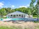 Stunning backyard features a pool, spa, and covered lanai, creating an ideal space for relaxation and entertainment at 28432 Tammi Dr, Tavares, FL 32778