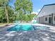 Beautiful pool and spa area surrounded by lush landscaping, offering a private and serene outdoor escape for relaxation and enjoyment at 28432 Tammi Dr, Tavares, FL 32778