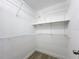 Spacious walk-in closet with plenty of shelving for storage and organization at 28432 Tammi Dr, Tavares, FL 32778
