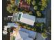 Aerial view showcasing the property's pool, dock, and waterfront location, surrounded by greenery at 3110 John Anderson Dr, Ormond Beach, FL 32176