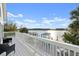 Balcony overlooking the water and surrounding landscape with patio furniture at 3110 John Anderson Dr, Ormond Beach, FL 32176