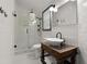 Elegant bathroom features a sleek glass shower door and a unique vessel sink on a vintage-style vanity at 3110 John Anderson Dr, Ormond Beach, FL 32176