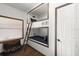 Bright room showing built-in bunk beds with wooden ladder, individual reading lights and bedside decor at 3110 John Anderson Dr, Ormond Beach, FL 32176