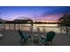 Beautiful waterfront deck with comfortable seating and lovely sunset views for relaxation at 3110 John Anderson Dr, Ormond Beach, FL 32176
