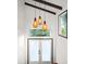 Bright entryway featuring pendant lighting, decorative glass, and striking architectural details at 3110 John Anderson Dr, Ormond Beach, FL 32176