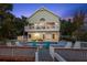 Beautiful two-story home with waterfront pool and deck, perfect for outdoor living and entertaining at 3110 John Anderson Dr, Ormond Beach, FL 32176
