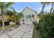 Charming home with a two-car garage, lush landscaping, and a welcoming entrance at 3110 John Anderson Dr, Ormond Beach, FL 32176