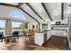 Open concept dining and kitchen area with waterfront views and island with sink and seating at 3110 John Anderson Dr, Ormond Beach, FL 32176
