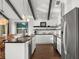 Bright kitchen featuring stainless steel appliances, dark countertops, and wood-look flooring at 3110 John Anderson Dr, Ormond Beach, FL 32176