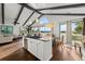 Open concept kitchen with island and sink, waterfront views and modern appliances at 3110 John Anderson Dr, Ormond Beach, FL 32176