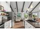 Open concept kitchen with island and sink, waterfront views, modern appliances and breakfast bar at 3110 John Anderson Dr, Ormond Beach, FL 32176