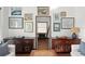 Stylish living room featuring hardwood floors and curated decorations on sideboards, all bathed in natural light at 3110 John Anderson Dr, Ormond Beach, FL 32176